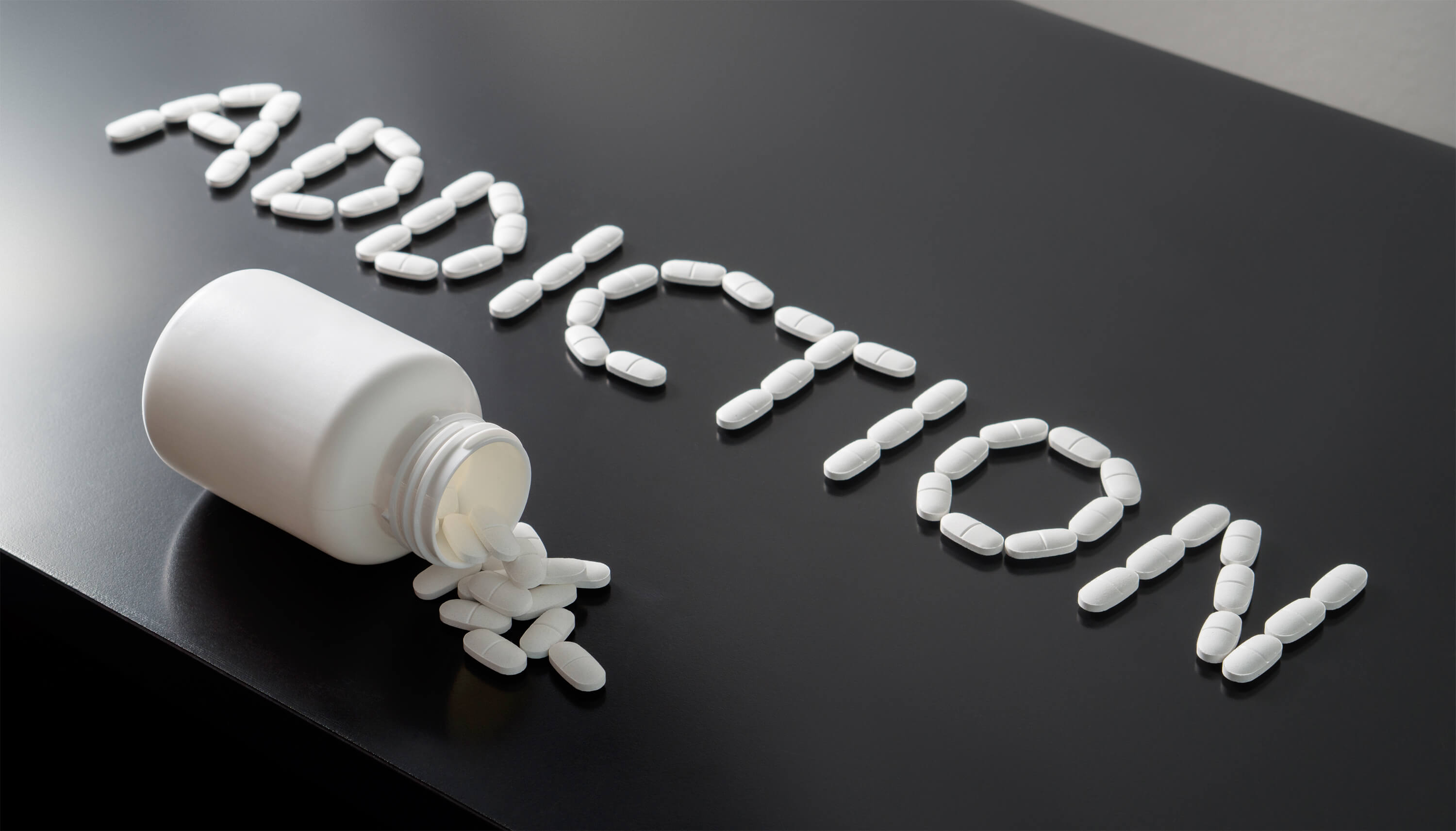 addiction spelled out in pills